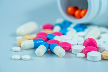 Macro shot of various colored pills on a white background, close-up health care and medical concept