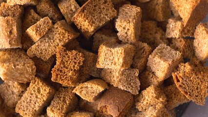 Baked bread crumbs. Close-up from above. Snack for drinks. Snack. Dry pack. Rye bread. Wheat product. Hungry time.