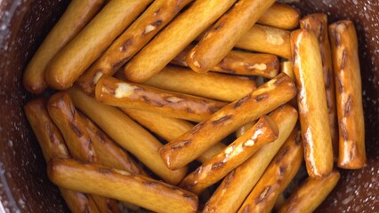 Baked sweet sticks. Appetizer and dessert. Fresh bakery. Close-up. Food. Flour product. View from above.