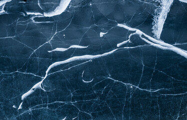 A frozen lake in the field in winter