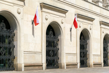 State red and white flag of Poland on the facade of a government building	