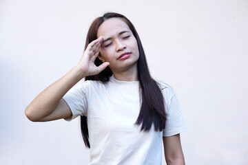 Fototapeta premium Asian woman has a headache stress from work