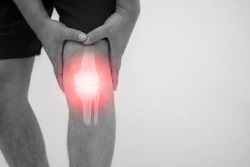 Joint pain, arthritis and tendon problems. A man touches the pain point