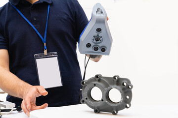 Engineer scans the detail with 3D scanner for reverse engineering