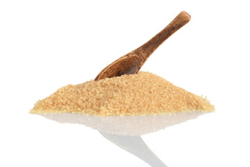 pile of raw sugar with wood spoon