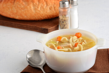 closeup turkey noodle soup with carrots
