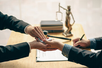 When a court or lawyer receives money from a businessman in exchange for a grant Making an unjust...