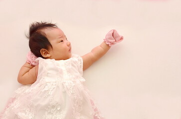 Baby looks at the blank space top view on white background