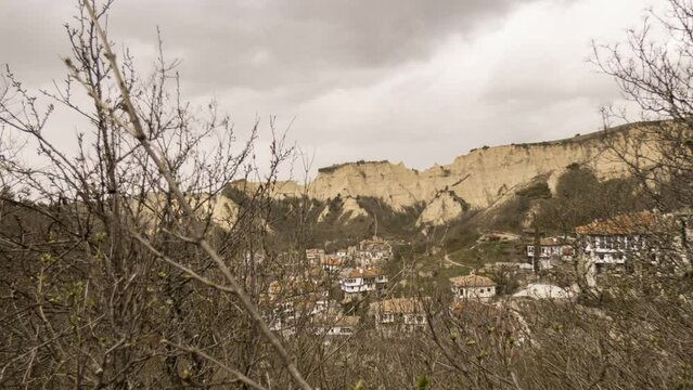 Time lapse video with scenic view of the majestic soundstone pyramids surrounding the tourist town of Melnik in Bulgaria on a springtime day