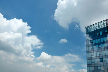 Fototapeta na wymiar city skyline with clouds and windows
