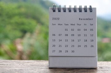 November month calendar with blurred nature background. Copy space and new month concept - obrazy, fototapety, plakaty