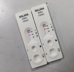 Rapid test kit for Malaria Ag (Pf,Pv) test, showing result plasmodium vivax positive and plasmodium...