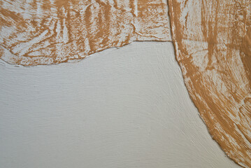 curvilinear abstract background with close-up detail and uneven surface texture, white and light brown background colour with empty space for text