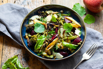 Warm salad with roast beetroor, broccoli, apple, fennel and crispy capers