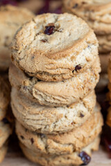 delicious dried cookies made of high-quality flour with dried red cranberries on the table