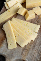 fresh yellow milk cheese on a board