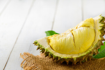 Durian and durian peels  (monthong) on sack and old wood background,