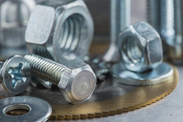 set of different nuts, bolts, screws, washers and drill bits,thread tap and mill cutters on steel...