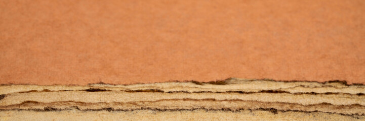 abstract landscape in earth tones - a collection of handmade Indian papers produced from recycled cotton fabric, wide web banner