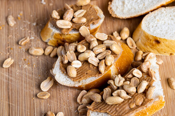 Fototapeta premium wheat fresh baguette and peanut paste