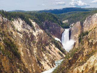 Lower falls waterfall in the Grand Canyon of Yellowstone, Yellowstone National Park, Wyoming, USA. Overlook of world famous waterfall on a beautiful sunny day with vivid colors.