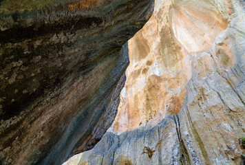Hiker admiring vertical rock walls, Torrent de Pareis, Sa Calobra, Majorca, Balearic Islands, Spain