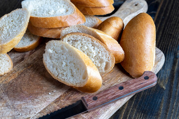 wheat baguette cut into pieces on a cutting board