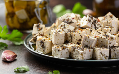 Vegan Tofu feta cheese with dried oregano, basil, thyme and garlic. Healthy Food.