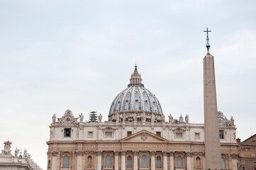 Fototapeta na wymiar Vatican obelisk and Dome of Saint Peters Basilica in Rome, Italy