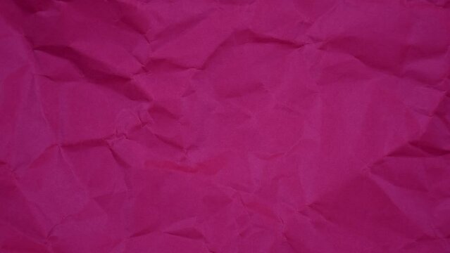 Crumpled wrinkled sheet of paper background texture. Stop motion animation. Seamless looping.