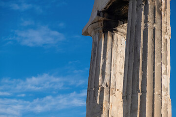 Roman Agora, Athens Greece. Gate of Athena Archegetis columns detail, blue sky background