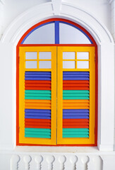Antique wooden windows painted in beautiful colors.