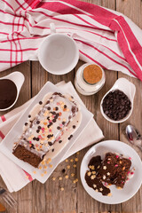 Sponge cake with white frosting and sugars.
