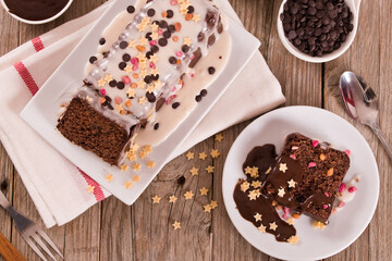 Sponge cake with white frosting and sugars.