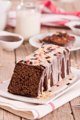 Sponge cake with white frosting and sugars.