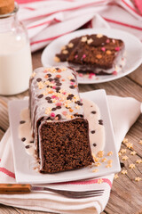 Sponge cake with white frosting and sugars.