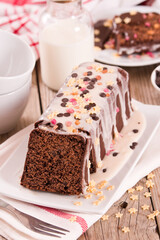 Sponge cake with white frosting and sugars.