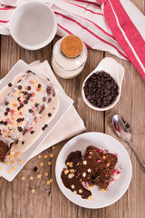 Sponge cake with white frosting and sugars.