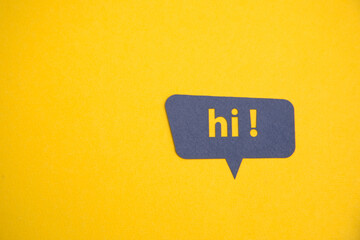 Hello speech bubble on the yellow background.