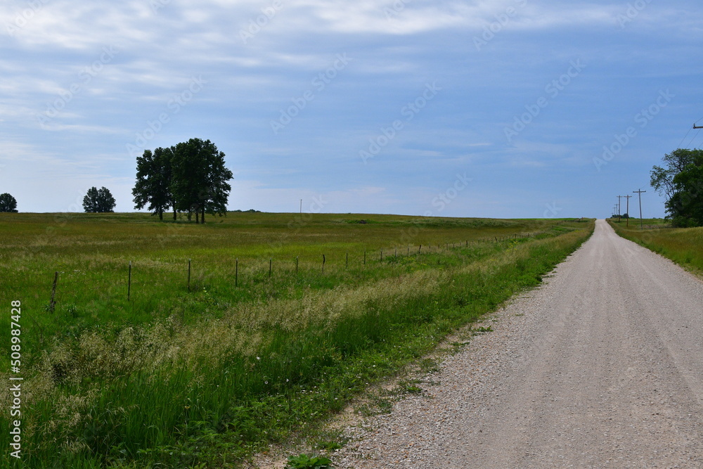 Sticker gravel road by a field