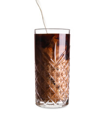 Pouring of milk into glass with iced coffee on white background