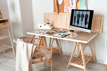 Workplace of clothes stylist in modern studio