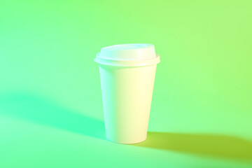 Takeaway paper cup on green background