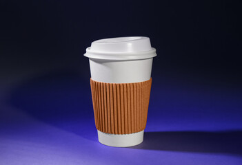 Takeaway paper cup on dark color background