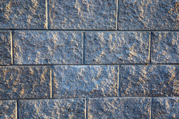 a part of the wall of a building made of bricks