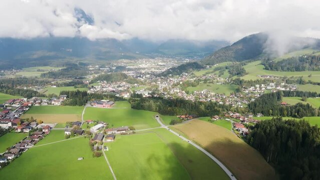 Aerial shot of beautiful villages in a valley surrounded by alpine mountain landscape in summer, Alpbachtal, Tyrol, Austria.
