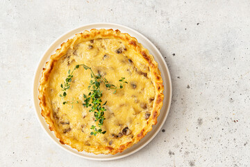 Homemade quiche pie with mushrooms (champignons) , potato  and cheese 