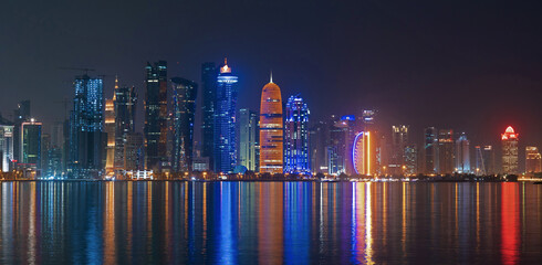 Doha skyline with many towers during the night. - Powered by Adobe