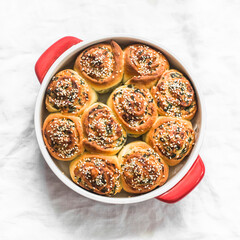 Spring garden herbs cheese buns - a delicious snack, snack, baking on a light background, top view
