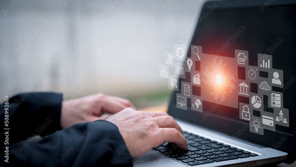 Poster closeup image of a business man's hands working and typing on laptop computer keyboard on office tab
